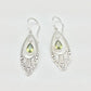 Alloy earrings with intricate cutout design and rhinestones
