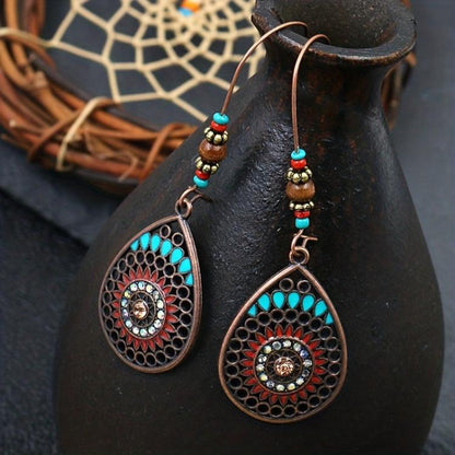 Stylish copper earrings with teardrop and oil drip details