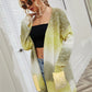 Yellow-green gradient cardigan styled casually with jeans
