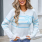 Woman wearing blue Angel Wings striped round neck sweater with bow design
