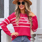 Woman wearing hot pink Angel Wings striped round neck sweater with bow design
