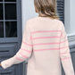 Back view of pink Angel Wings sweater with delicate stripes and bow detail
