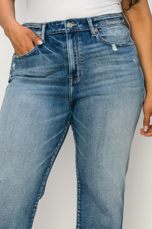 Comfortable stretch jeans for plus-size women with a distressed look.
