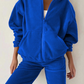 Closeup of the casual blue hooded sweater set in soft polyester fabric.
