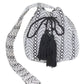 Front view of Aztec Jacquard Boho Swing Bucket Bag with black tassel accents.
