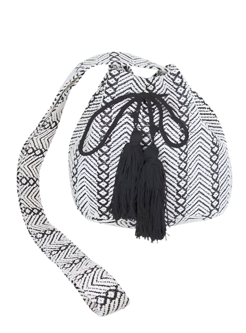 Front view of Aztec Jacquard Boho Swing Bucket Bag with black tassel accents.
