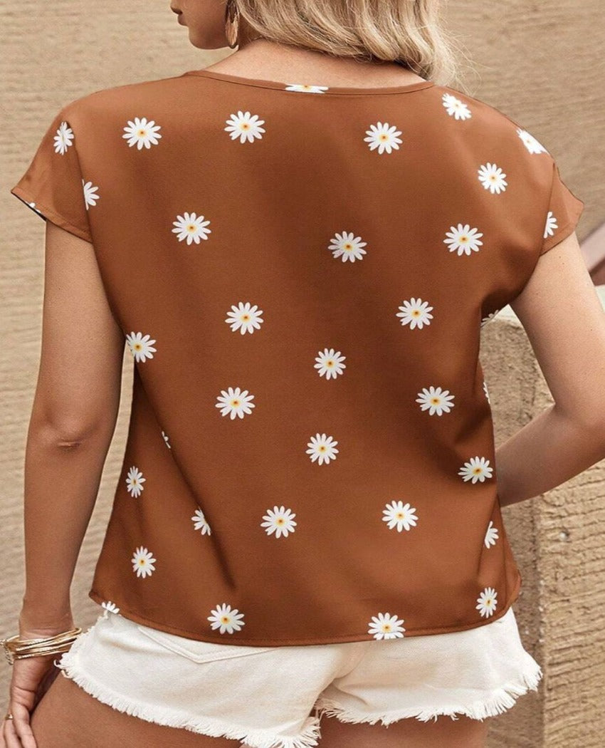 Stay cool and chic in our Daisy Printed Blouse - perfect for any summer occasion with its airy fit and playful design