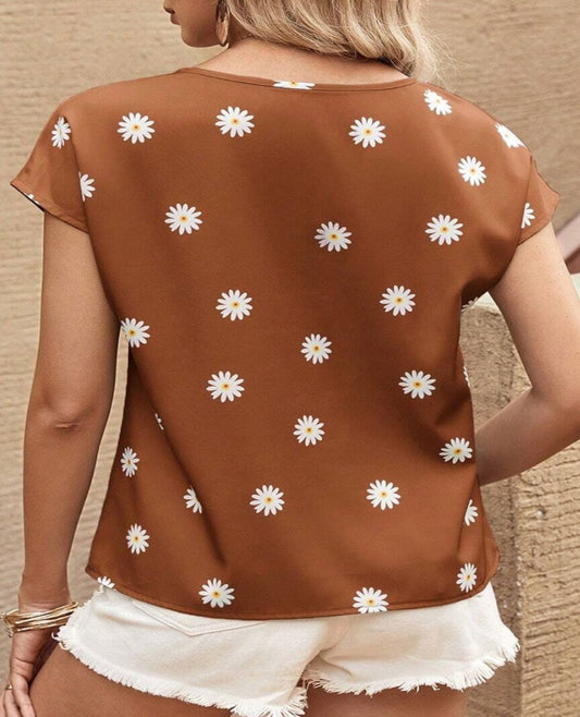 Stay cool and chic in our Daisy Printed Blouse - perfect for any summer occasion with its airy fit and playful design