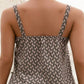Chic tank with unique buckle straps and a trendy notched neckline, perfect for adding elegance to your casual wear.