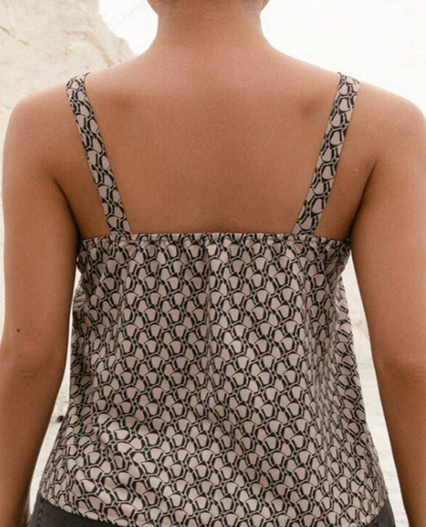 Chic tank with unique buckle straps and a trendy notched neckline, perfect for adding elegance to your casual wear.