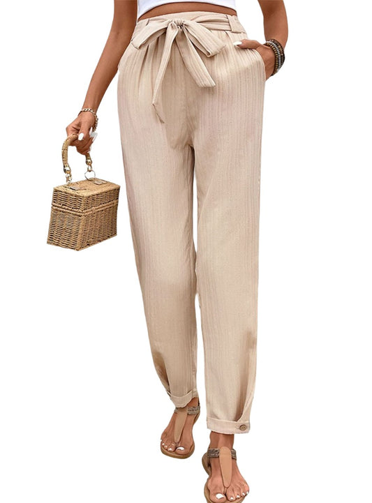 Beige boho chic drawstring pants with tie-waist detail.