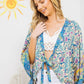 Floral patterned kimono in turquoise with tie front.