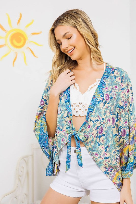 Floral patterned kimono in turquoise with tie front.