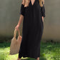 Lightweight black maxi dress with a classic V-neckline and side pockets.