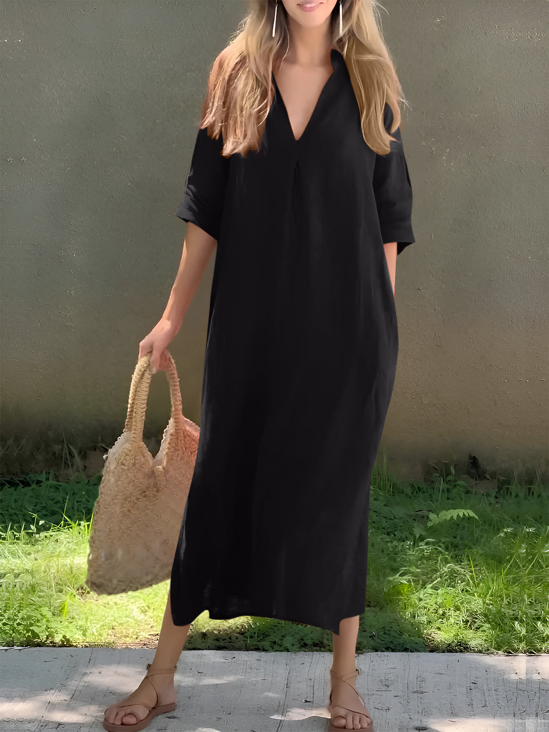 Lightweight black maxi dress with a classic V-neckline and side pockets.