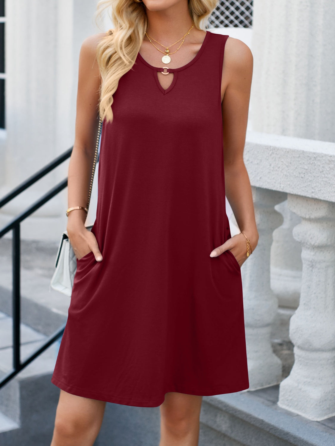 Elevate your wardrobe with our chic Cutout Round Neck Dress - perfect for any occasion, available in teal, wine, navy, and black.