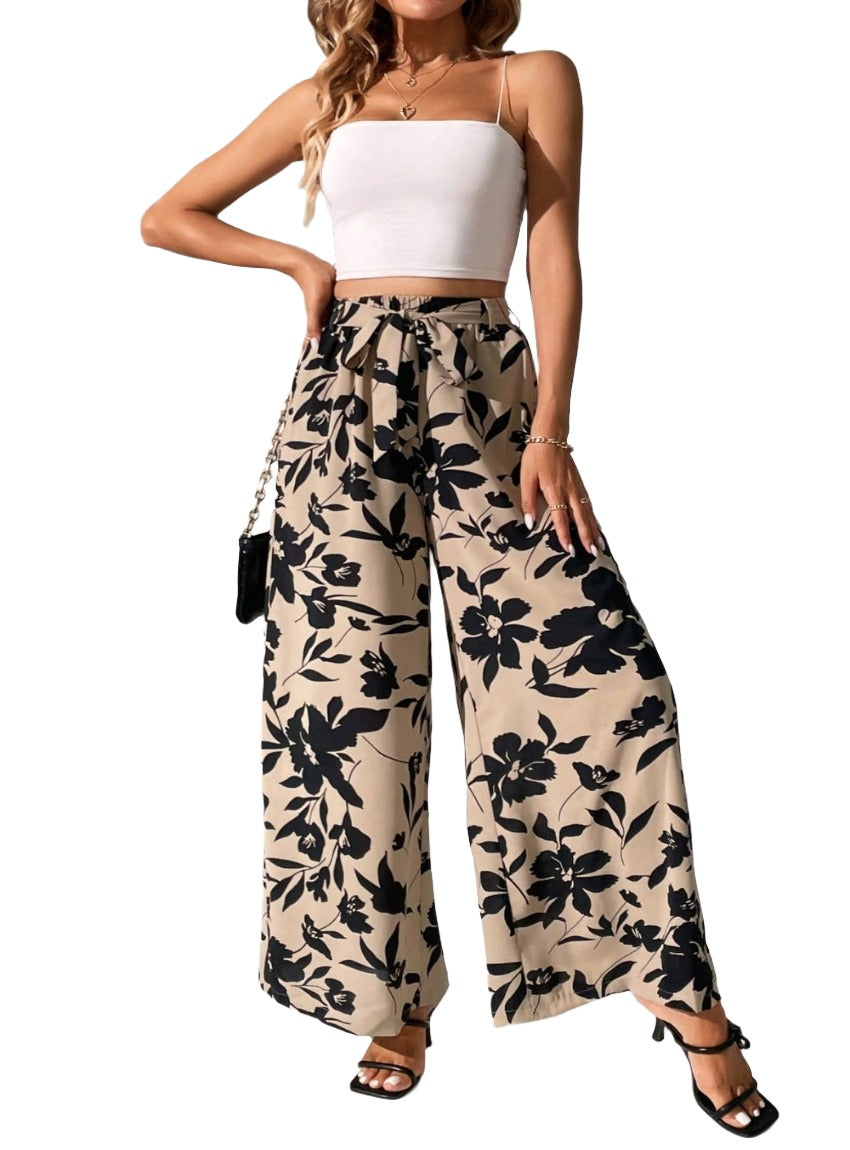 Upgrade your style effortlessly with our Printed Tied Wide Leg Pants. Chic, comfortable, and versatile - perfect for any occasion. Shop now!