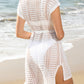 V-Neck Cover-Up in breathable openwork design, perfect for beach elegance. Available in sand, white, and black. Shop now for summer style!