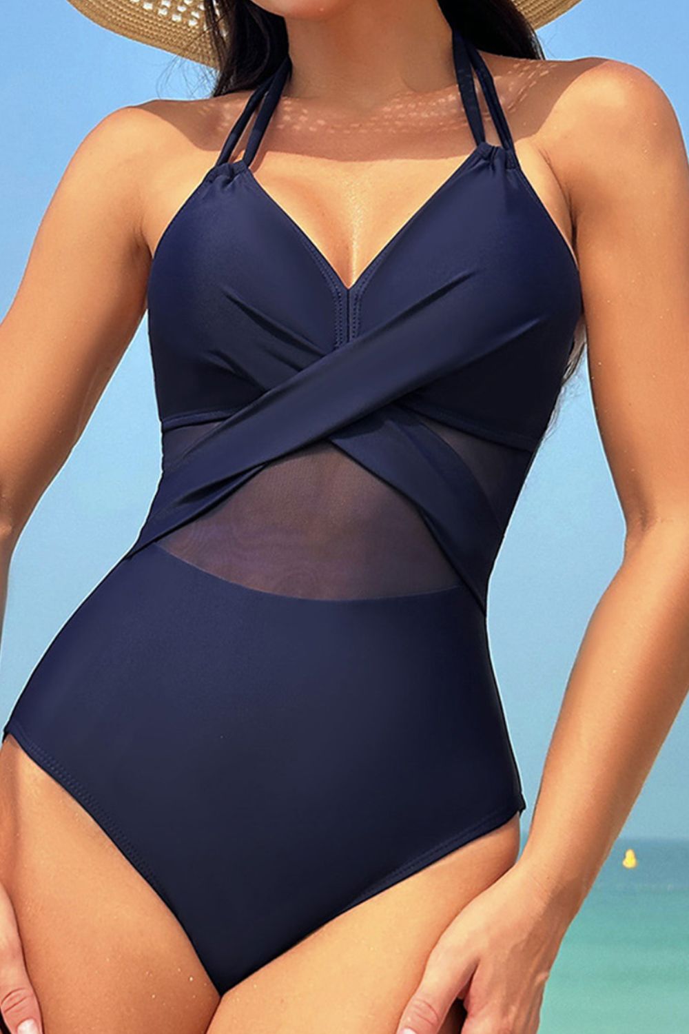 Elevate your poolside look with our elegant Crisscross Halter One-Piece Swimwear, offering a blend of style, comfort, and versatility.