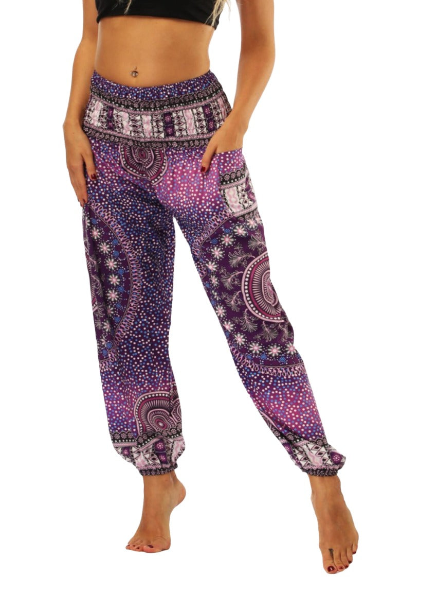 Elastic waistband harem pants in purple with floral and geometric designs.