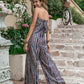 Embrace summer with our Printed Tube Wide Leg Jumpsuit. Perfect for any occasion, available in lilac, black, and camel. Shop now for effortless style!