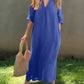 Versatile blue maxi dress with an elegant V-neckline and convenient pockets.