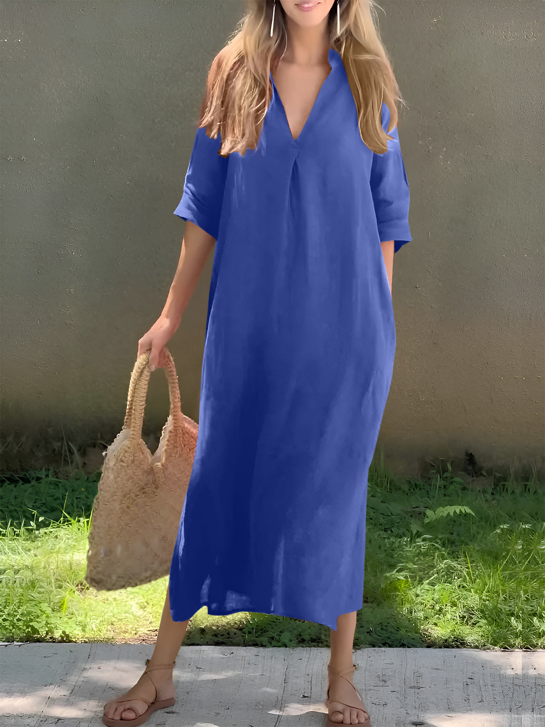 Versatile blue maxi dress with an elegant V-neckline and convenient pockets.