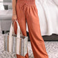 Wide-leg pants featuring breathable fabric in several color options.