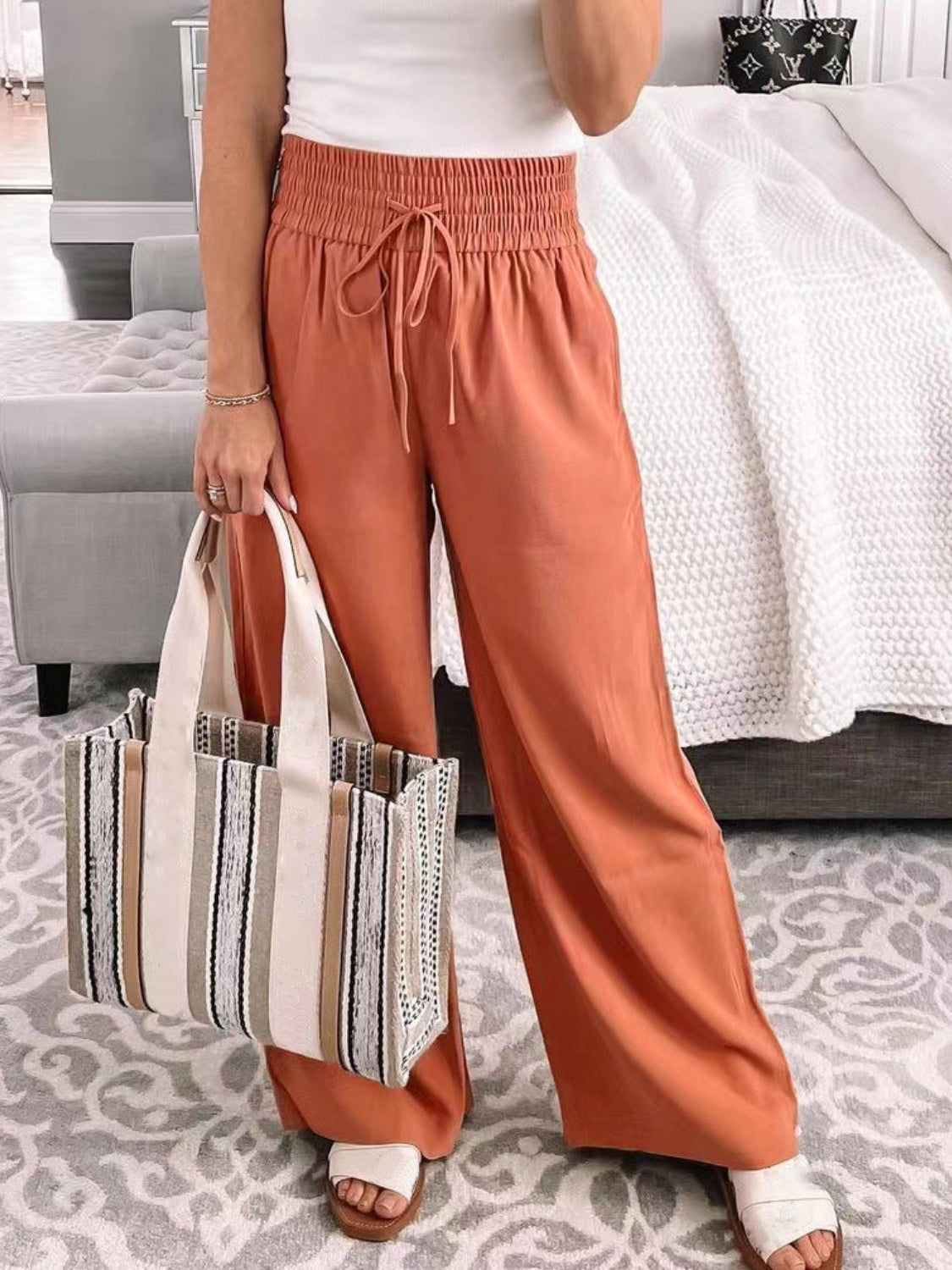 Wide-leg pants featuring breathable fabric in several color options.