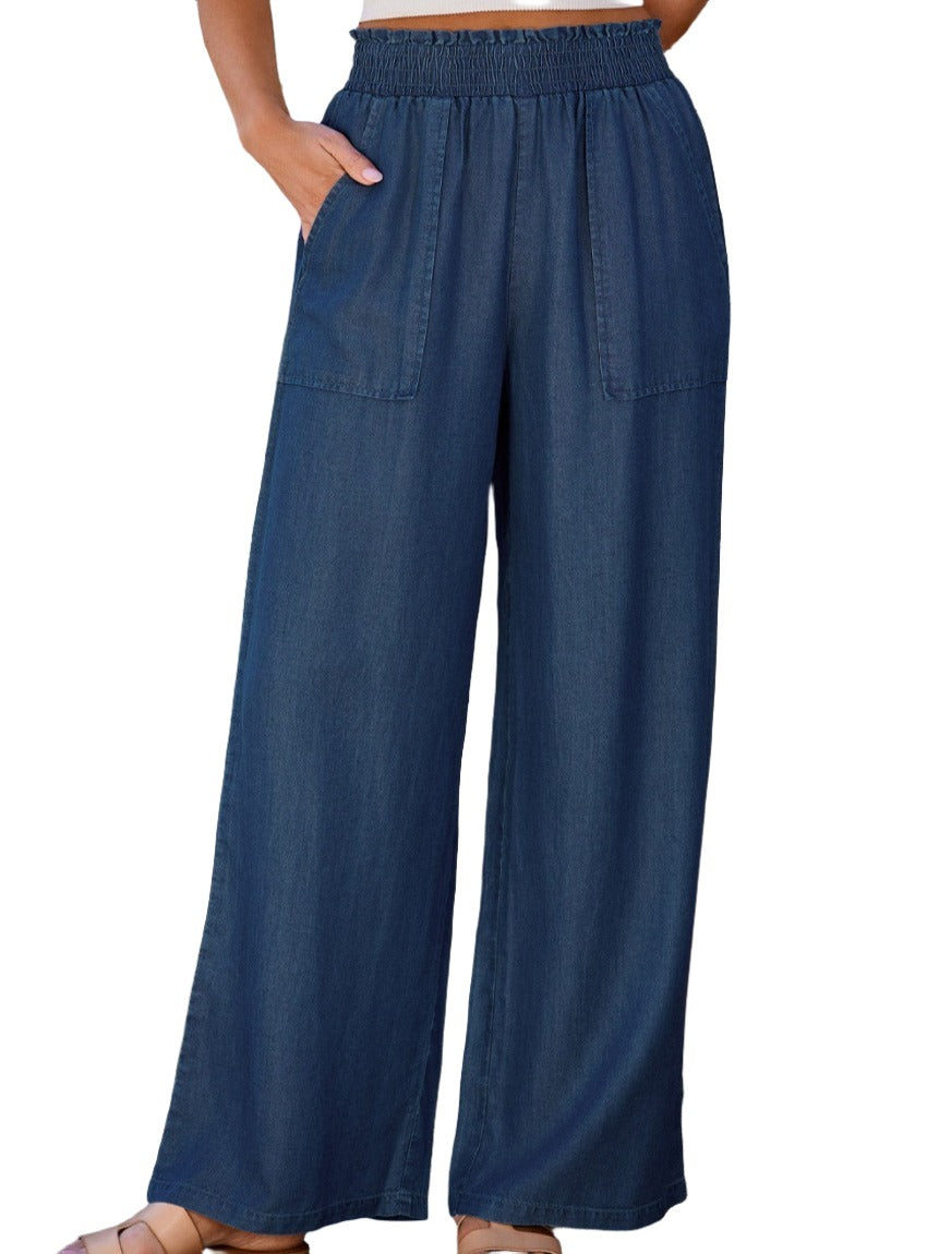 Comfortable wide-leg blue lyocell pants featuring large front pockets.