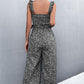 Stylish Printed Jumpsuit with ruffle straps & a smocked waist for a flattering fit. Perfect for any occasion!
