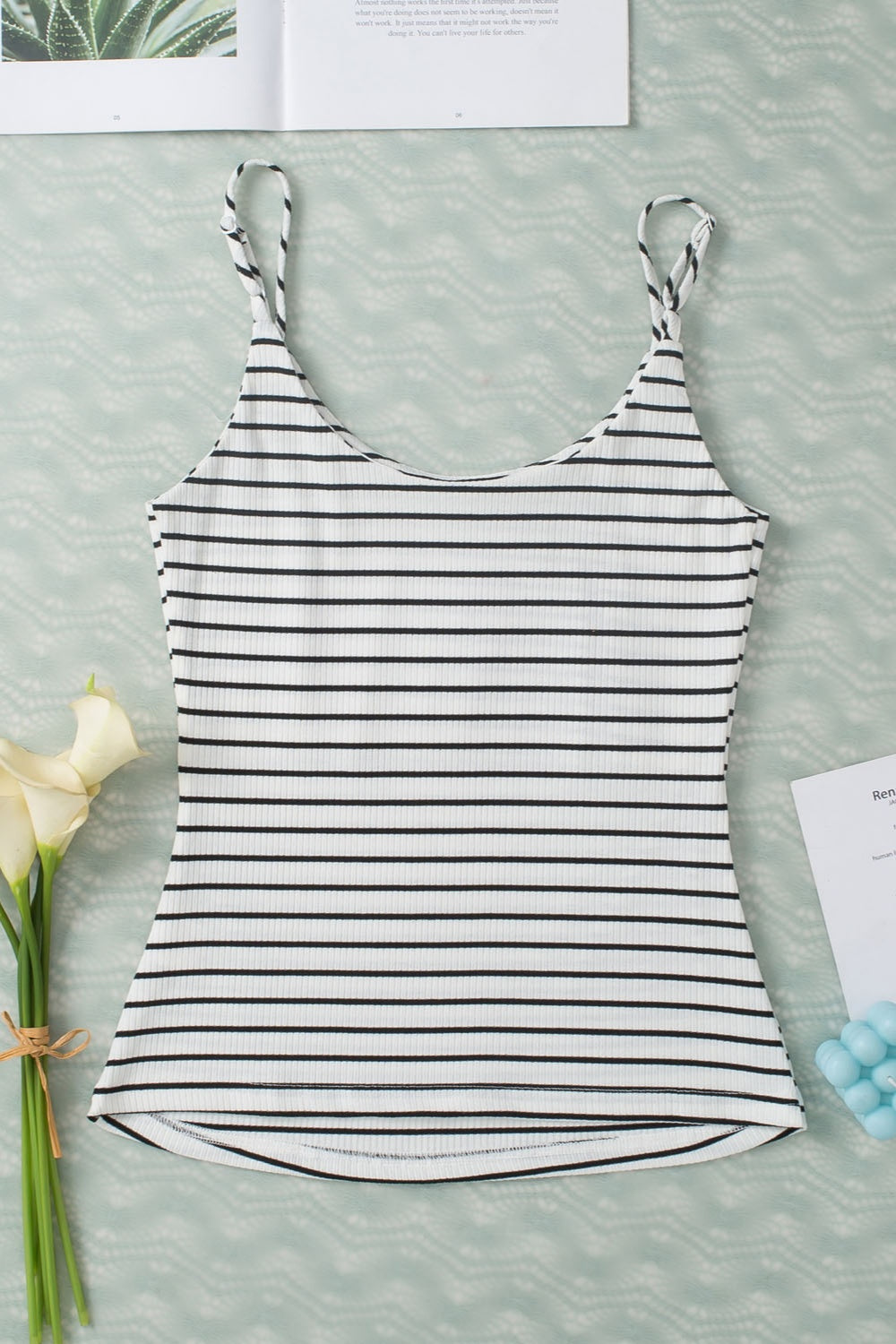 Stylish black and white striped tank top for women.