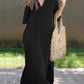 Stylish black maxi dress featuring a V-neck and breathable fabric.
