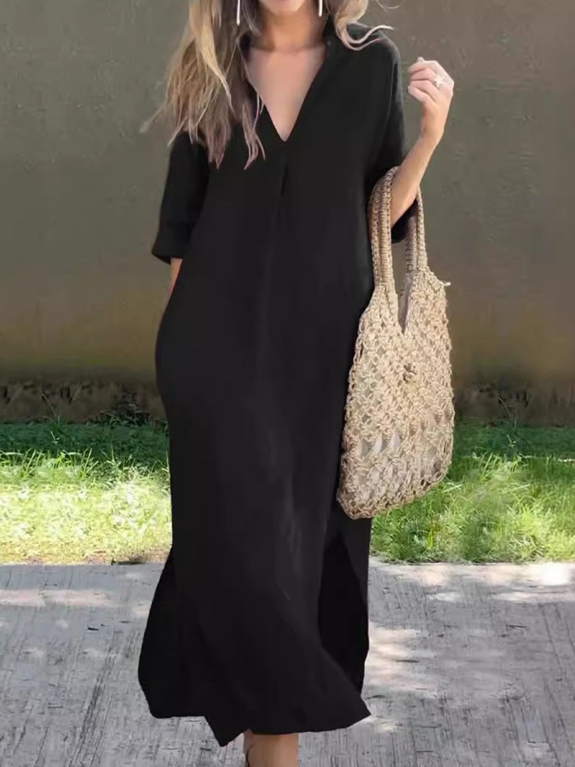 Stylish black maxi dress featuring a V-neck and breathable fabric.