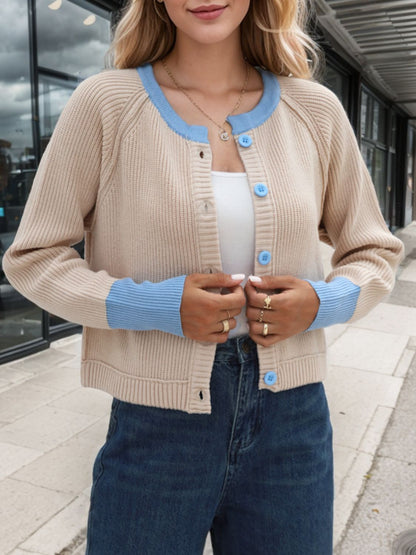 Beige cardigan with blue trim, designed with a button-down front for easy layering over outfits.