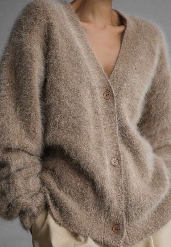 Beige oversized button-front cardigan with a fuzzy texture
