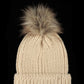 Beige winter knit beanie with faux fur pom for added style.
