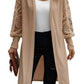 Woman wearing a beige lantern sleeve cardigan, front view
