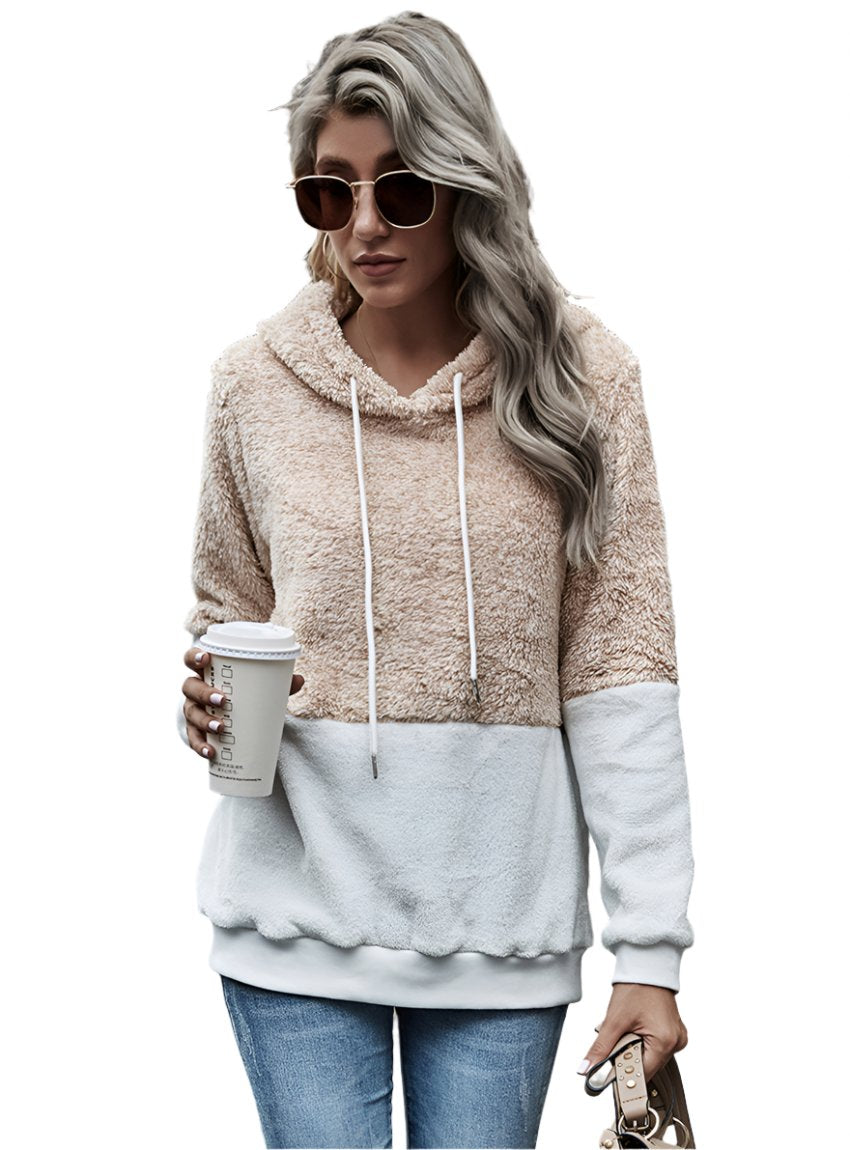 Front view of a beige sherpa hoodie with a white color block design.
