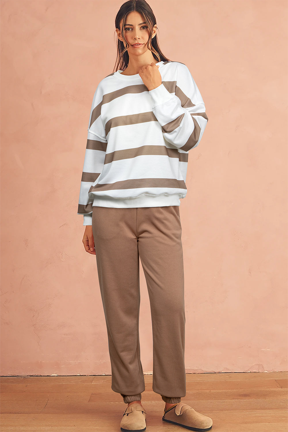 Women’s beige striped jogger set with pullover and elastic waist pants
