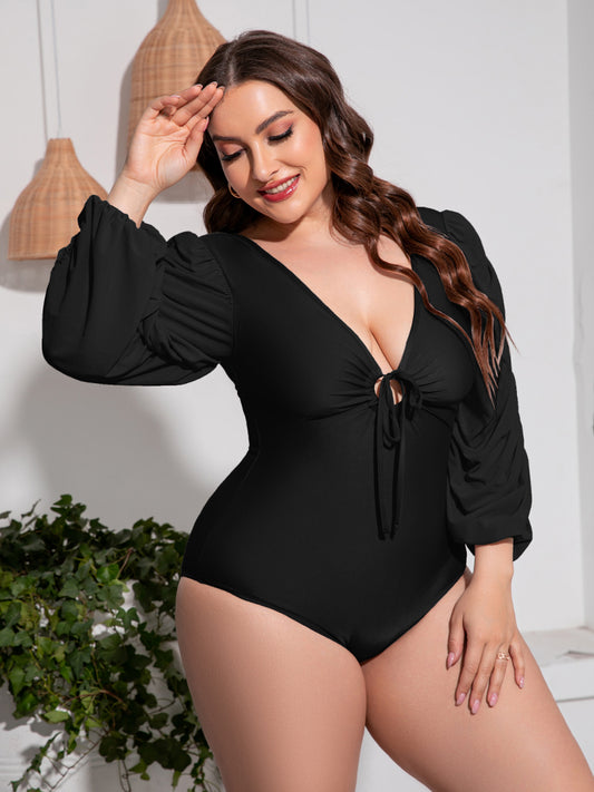 Flatter your curves with our Plus Size Tied Deep V Balloon Sleeve Swimsuit. Stylish comfort in gray or black. Perfect for confident beach vibes.