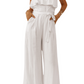 Elevate your style with our Tie-Waist Ruffled Strapless Jumpsuit. Flattering fit, chic design, perfect for any occasion. Available in white and black