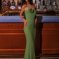 Elegant green floor-length gown with a strapless neckline and flower detail