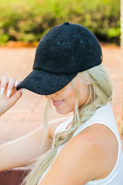 Black adjustable terry cap with non-structured crown
