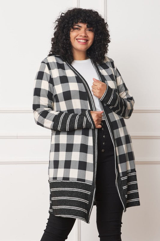 Woman wearing black and ivory plaid cardigan, front view.