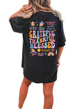 Back design of black "Be Kind to Your Mind" tee featuring colorful positive messages.