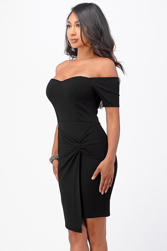 Elegant black bodycon dress with a twist detail and off-shoulder neckline, perfect for any event.
