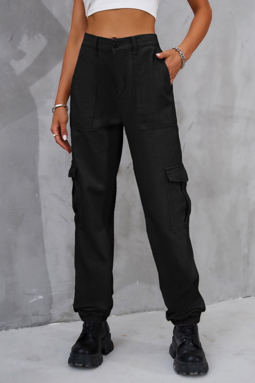 Black buttoned high-waist cargo pants shown in a front view.
