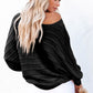 Comfortable black knit sweater with ribbed texture
