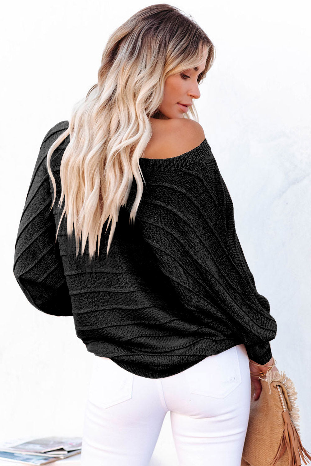 Comfortable black knit sweater with ribbed texture
